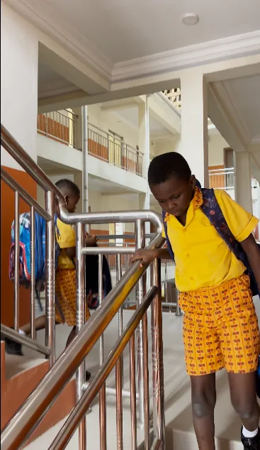 Students on stairs in school building